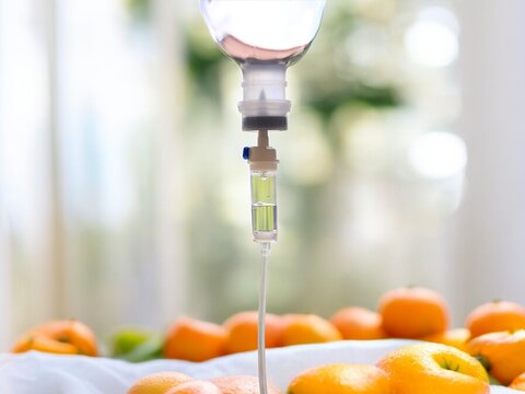 Natural orange fruits vitamin c nutrition iv drip therapy drug treatment concept.