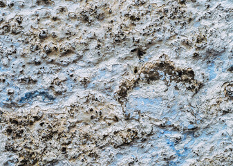 Old white, blue painted wall.