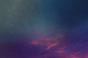 Beautiful sunset sky above clouds with dramatic light. Cabin view from airplane