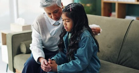 Woman, therapist and hug with child for appointment, care or support in counseling or therapy session on sofa. Female person or psychologist talking to young kid or little girl for comfort or trust