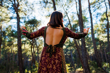 young and beautiful dancer practicing intently among natural landscapes. A young and beautiful girl...