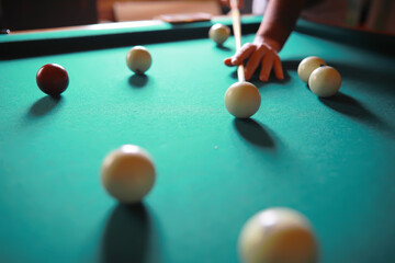 Russian billiard balls, cue, triangle, chalk on a table Green cloth Copy space