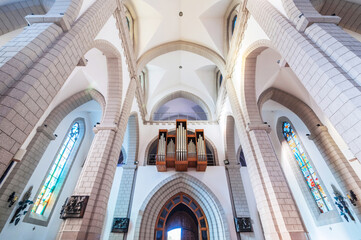 Christian Catholic church with organ pipes on the wall. Sacred Heart of Jesus Cathedral in Tashkent...