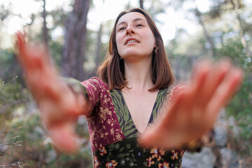 Concept of balance, harmony and health. girl alone with nature. a girl dances and sings in the...