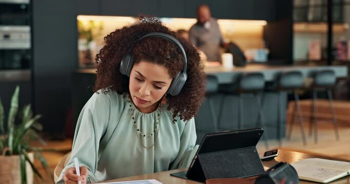 Tablet, notes and woman with headphones in home office with online course for language learning. Writing, listening and freelance consultant with digital app for elearning, translation or research