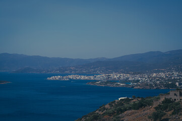 Panoramic view of Agios Nikolaos, Crete's Island, Greece. A scenic blend of sea, sky, and urban charm