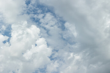 White cirrus clouds on a blue sky before rain