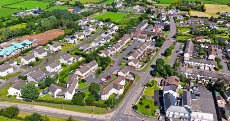 Aerial view of Residential homes town houses and bungalows in Ballystrudder Village Larne Co Antrim Northern Ireland