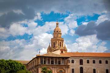 Fototapeta premium View of the city of Murcia from the Segura river with the Episcopal palace and the cathedral tower in the background