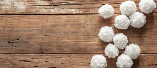 Flat lay of snowballs on wooden background with copy space image.
