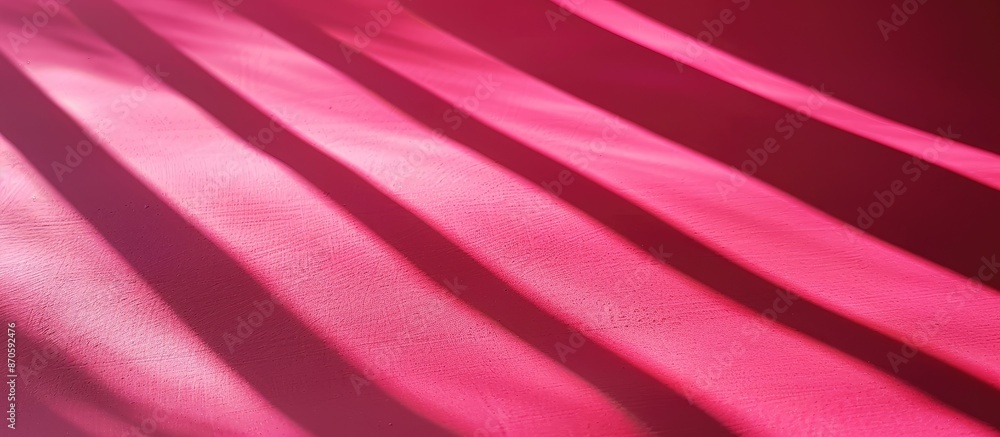 Poster Close-up view of vivid shadows on pink background with copy space image.