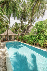 Interior and exterior design of luxury pool villa beautiful poolside and sunny sky. Luxurious...