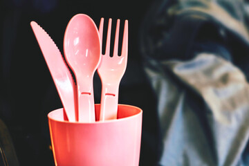 Camping.Pink plastic dinnerware set.Cup,fork,knife,spoon