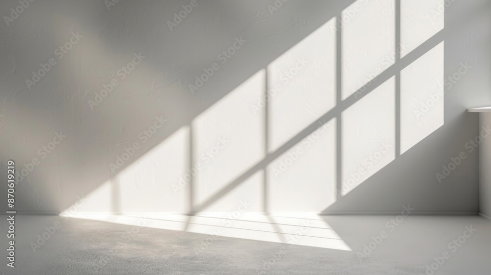Poster a subtle interplay of light and shadow on a white wall, with an angled shadow from a forgotten objec