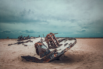 old historic shipwreck on the east beach on the island of Norderney in the North Sea