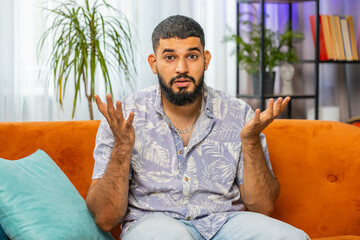 What. Why. Frustrated Indian man raising hands in indignant expression, asking reason of failure,...