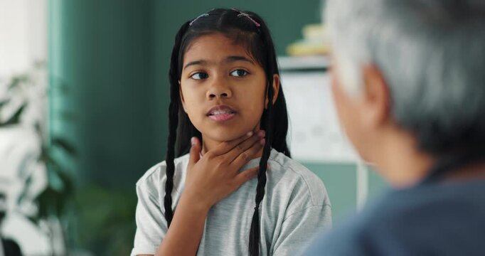 Woman, doctor and consulting girl with question for throat infection, pain or tonsils at clinic. Specialist, pediatrician and little child in medical checkup for exam, virus or physical diagnosis