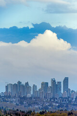 Overview of Metrotown cityscape on cloudy sky background