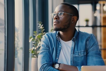 Fototapeta premium Dreamy man in glasses visualizing new opportunities at table.