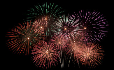 DIfferent colros and types of fireworks in the sky background