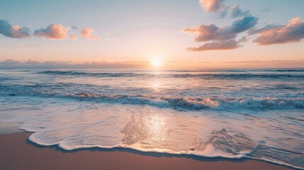 Obraz premium A peaceful beach with the first light of dawn breaking over the horizon, symbolizing hope and new beginnings.