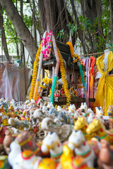 A spirit house or Joss house built for guardian spirit to reside with Traditional thai costumes and...