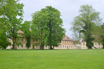 Fototapeta premium Luebbenau castle park with Orangerie and view to the city church