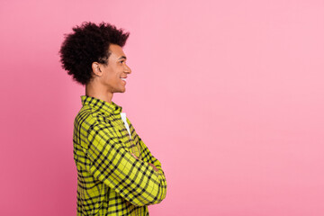 Photo of nice young man crossed arms empty space wear shirt isolated on pink color background