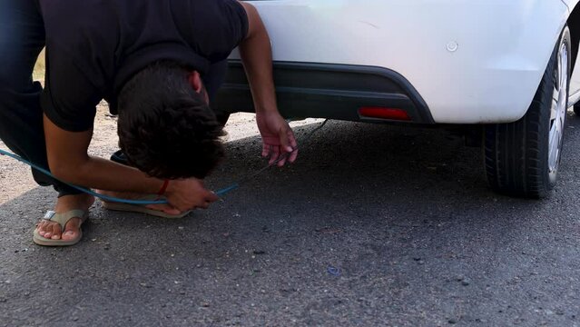 pollution checking of car under progress at national highway at day