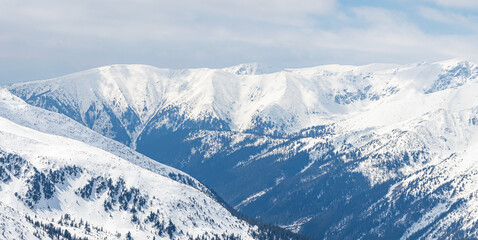 Fototapeta premium Winter mountain landscape in the Polish Tatra Mountains. View of the snow-capped peaks.