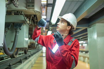 Technician Inspecting Train Suspension System