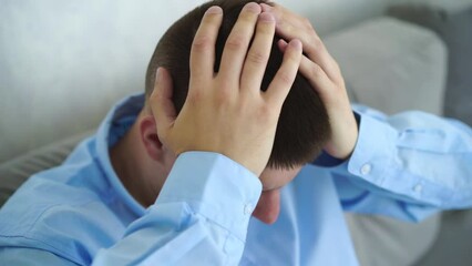 The man clutches his head in pain.
A man suffers from a headache
The man is holding his head.
Overwork, pain, sick, treat, work, fatigue