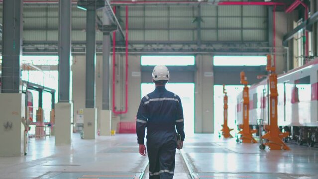 Train Engineers Discussing Maintenance in Depot
