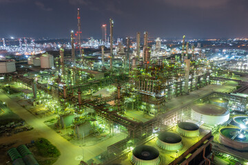 Fototapeta premium Nighttime Aerial View of Busy Refinery Complex