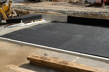 pneumatic pad at a construction site of tram tracks in a European city street. Made from recycled rubber of old tires.