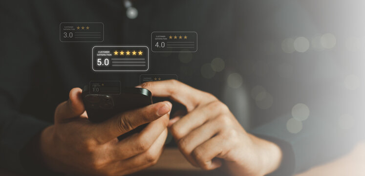 close up hand using smart phone and give five star symbol to increase rating of product and service concept. Customer review satisfaction feedback survey concept. 5 star score, happy smile