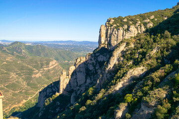 Landscape view at sunset from Montserrat mountain in Catalonia, with its characteristic rock formations creating unique reliefs in the sunlight