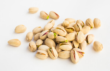 Delicious pistachios on a white background