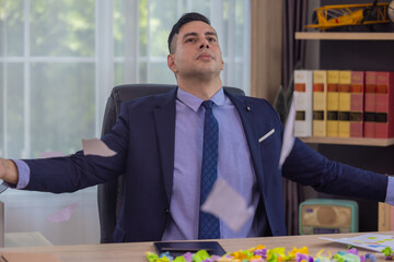 Frustrated Businessman Throwing Papers