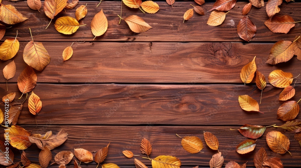 Poster autumn leaves border on wooden background - dried fall leaves frame a rustic wood surface, creating 