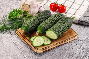 Raw green cucumbers with slices