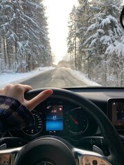 person driving car in snow