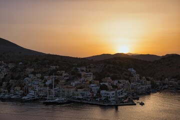 Beautiful sunset over Gialos bay, Symi island, Greece