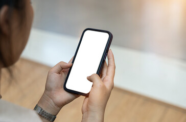 Woman hand holding blank screen mock up mobile phone. Blank smartphone screen for display montage