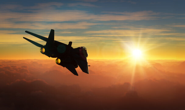 Silhouette of militar aircraft flying over the clouds in amazing sunset