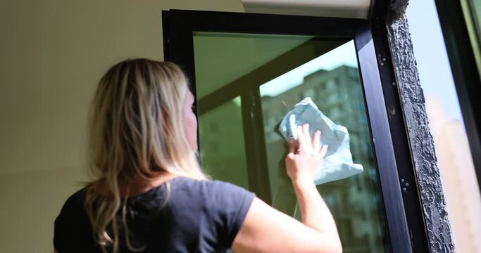 Housewife uses cloth to remove layers of dust and dirt