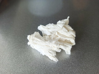Crumpled paper on a black background. Shallow depth of field
