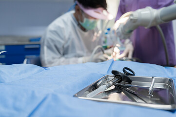 Close up dental tools and blurry of professional dentist making teeth cleaning patient background at the dental office.Scaling limestone.Healthy teeth and tooth care concept.