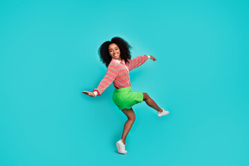 Obraz premium Full length photo of sweet pretty lady dressed print blouse dancing empty space isolated blue color background