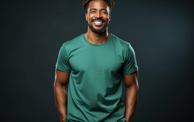 A man with a green shirt is smiling and posing for a picture. Concept of happiness and positivity